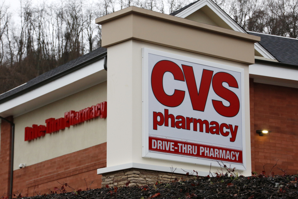 FILE - This Wednesday, Jan. 18, 2017, file photo shows a CVS Pharmacy in Pittsburgh. CVS Health, the second-largest U.S. drugstore chain, is buying Aetna, the third-largest health insurer. The evolution won't happen overnight, but in time, shoppers may find more clinics in CVS stores and more services they can receive through the network of nearly 10,000 locations that the company has built. (AP Photo/Gene J. Puskar, File)