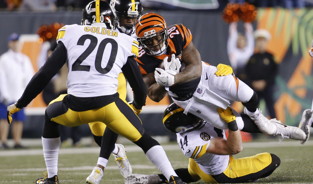 Bengals running back Joe Mixon is tackled by Steelers linebacker Tyler Matakevich during the first half Monday night in Cincinnati.