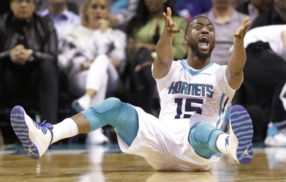Charlotte's Kemba Walker argues for a foul during the Hornets' 104-94 win over the Magic on Monday in Charlotte, North Carolina. Walker scored 29 points in his return from a shoulder injury.