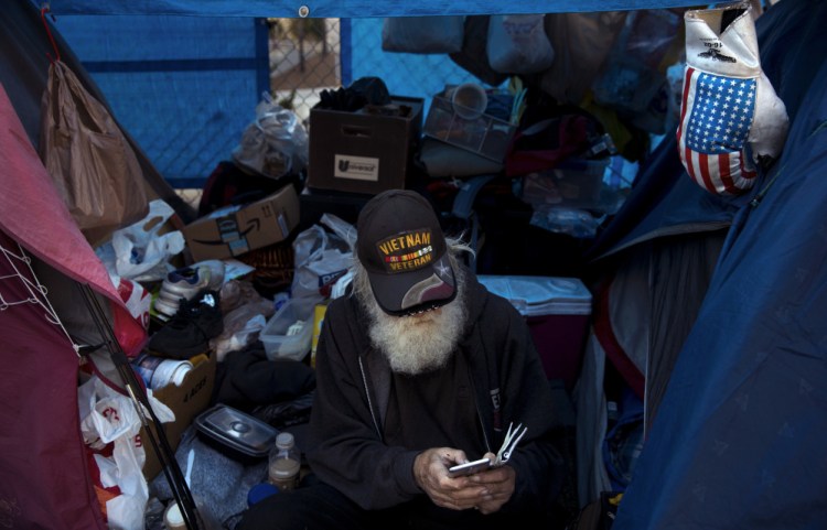 A federal initiative has nearly halved veteran homelessness, but 78-year-old Vietnam veteran Theodore Neubauer, who lives in a tent in Los Angeles, is among the 40,000 nationwide who still need housing.