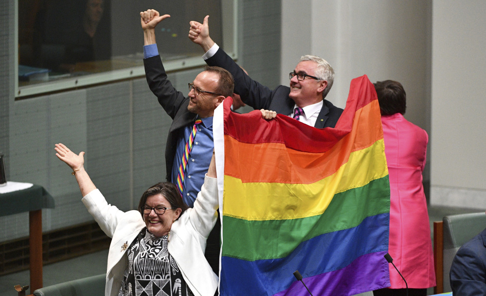Parliament members celebrate the nearly unanimous passing of the Marriage Amendment Bill in Canberra, Australia. "I think this is so wonderful," said Prime Minister Malcolm Turnbull.