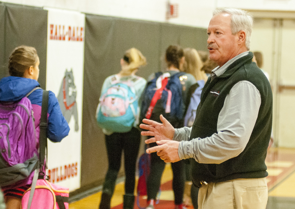 Hall-Dale athletic director Colin Roy greets the visiting Cony Middle School girls' teams and directs them to locker rooms before a game against the Hall-Dale Middle School Bulldogs on Tuesday at Hall-Dale High School in Farmingdale.