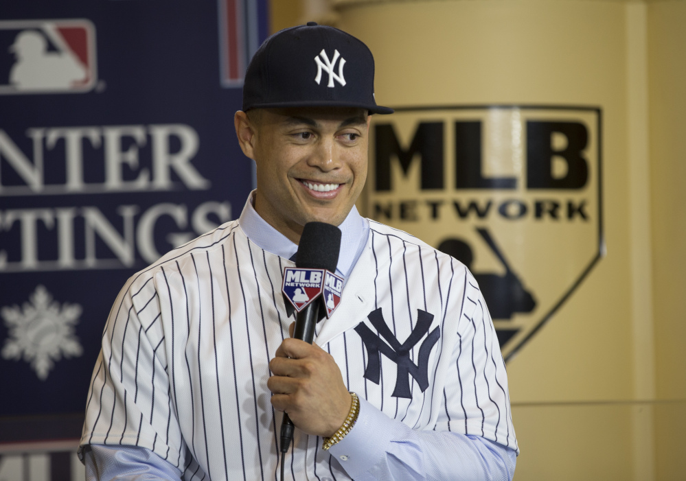 Giancarlo Stanton, who hit 59 home runs last season, has not played for a team that finished the season with a winning record in his eight-year career. On Monday, he officially joined the Yankees, who played in Game 7 of the ALCS in 2017.