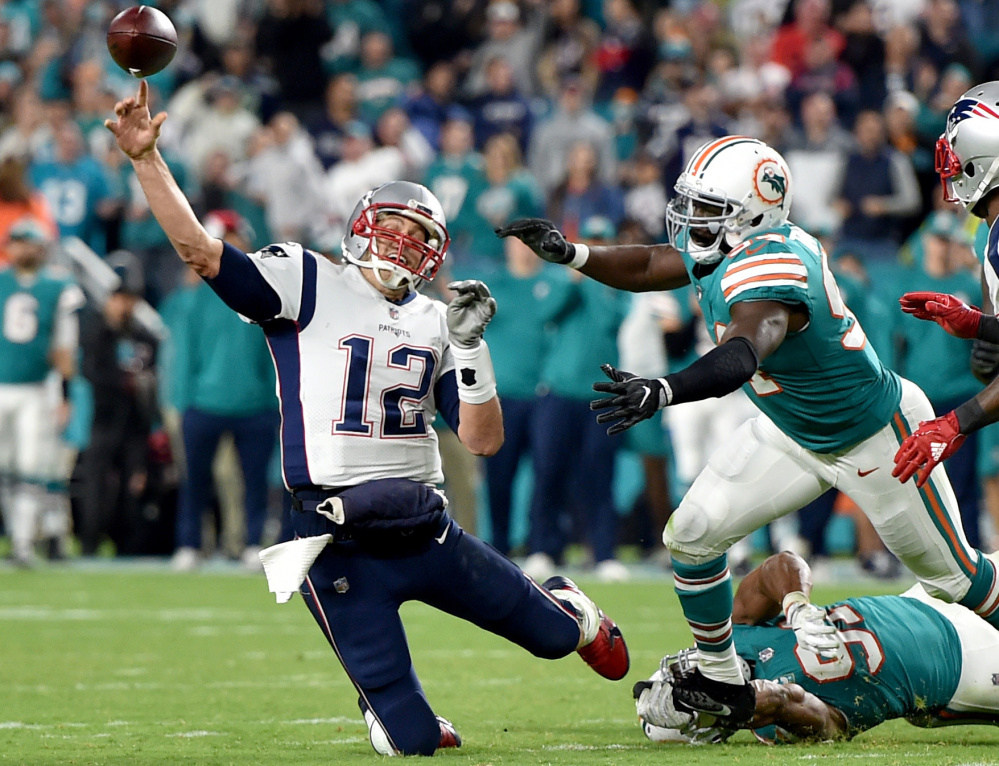 New England quarterback Tom Brady was under pressure all night long in a 27-20 loss at Miami on Monday.
