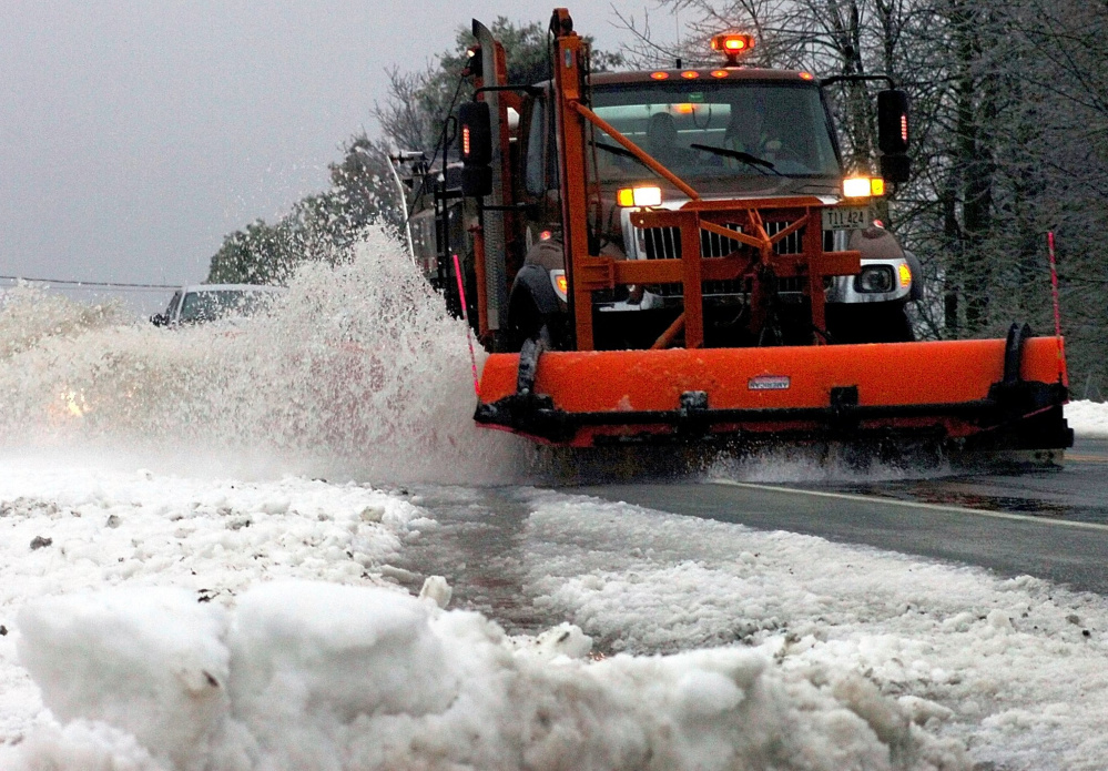 A Maine Department of Transportation plow truck driver clears Route 139 in Unity. The department currently has about 50 openings. Although the state offers good benefits, some drivers might be attracted to the better wages they can make in the private sector.