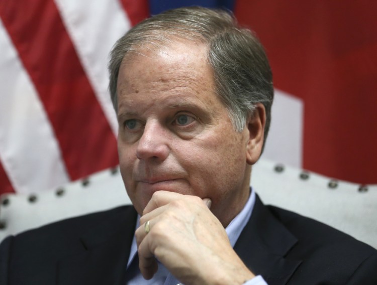 Democrat Doug Jones speaks during an interview with the Associated Press, in Birmingham, Ala.  Alabama Secretary of State John Merrill dismissed the viral story that over 5,000 of the votes for Jones in Tuesday's special U.S. Senate election were cast by the dead. "There are not 5,000 dead people on the voters rolls unless they died today," Merrill said on Thursday.