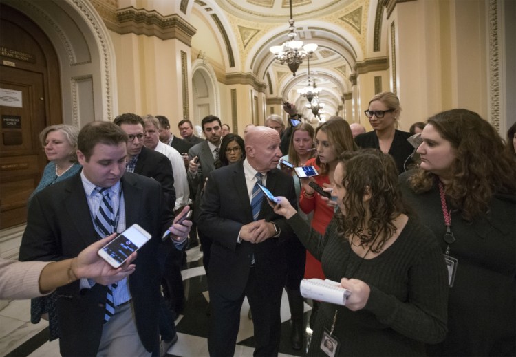 House Ways and Means Committee Chairman Kevin Brady, R-Texas, talks to reporters at the Capitol after Republicans signed the conference committee report to advance the Republican tax bill in Washington on Friday.