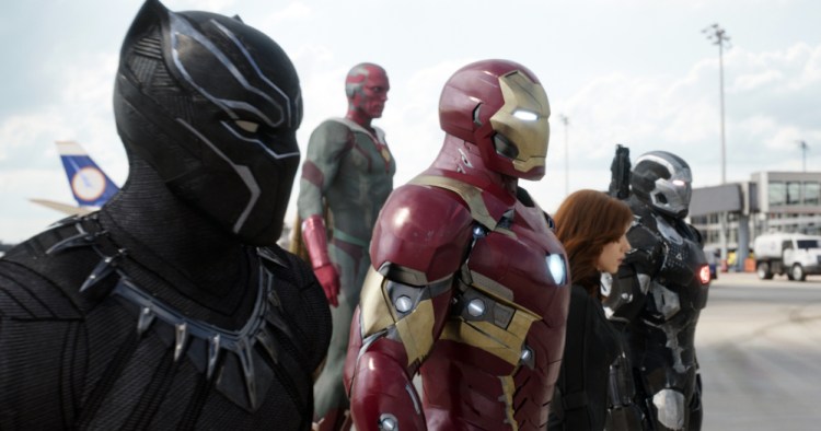 This file image provided by Disney shows, from left, Chadwick Boseman as Panther, Paul Bettany as Vision, Robert Downey Jr. as Iron Man, Scarlett Johansson as Natasha Romanoff, and Don Cheadle as War Machine in a scene from "Marvel's Captain America: Civil War." Disney's announcement Thursday, Dec. 14, 2017, that it's buying most of movie goliath Fox for $52.4 billion in stock brings these once disparate franchises together. The combined company will account for more than a third of theatrical revenues in the U.S. and Canada.