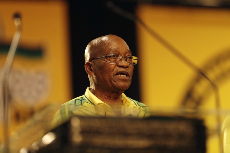 South African President Jacob Zuma addresses the African National Congress, of which he is also president, on Saturday. Zuma admits his scandals have darkened the ANC's future.