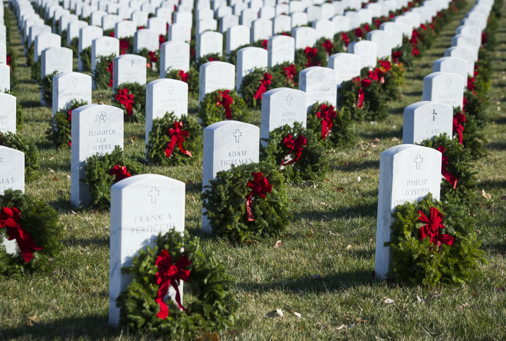 Maine-based Wreaths Across America, which placed these wreaths on headstones at Arlington National Cemetery in December 2017, will send Maine-made balsam wreaths to Normandy to honor Americans who died in the D-Day invasion and were buried in France.