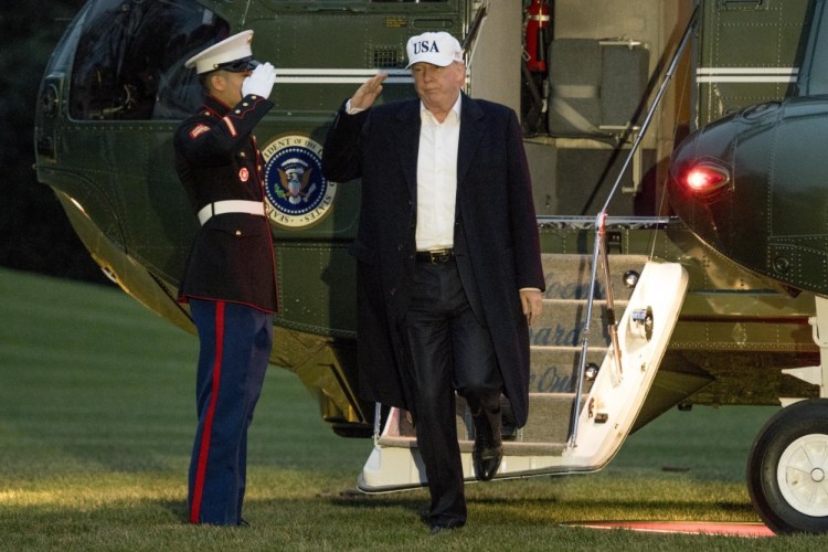 President Trump steps off Marine One on the South Lawn of the White House on Sunday after returning from Camp David in Maryland, where he spent the weekend. Asked if he is considering firing special counsel Robert Mueller, Trump said, "No, I'm not."