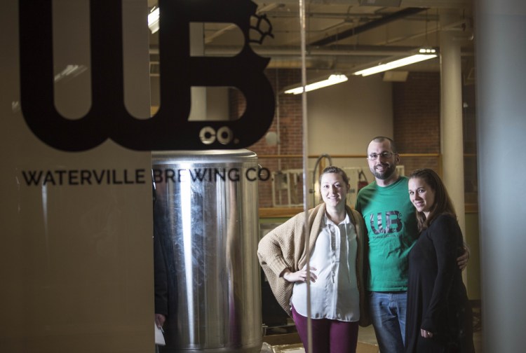 Waterville Brewing Co. co-owners, from left, Amber Willett, Ryan Flaherty and Candice Flaherty will open Augusta's first microbrewery, at Hathaway Creative Center. The fourth partner, Eric Willett, is on Army deployment.