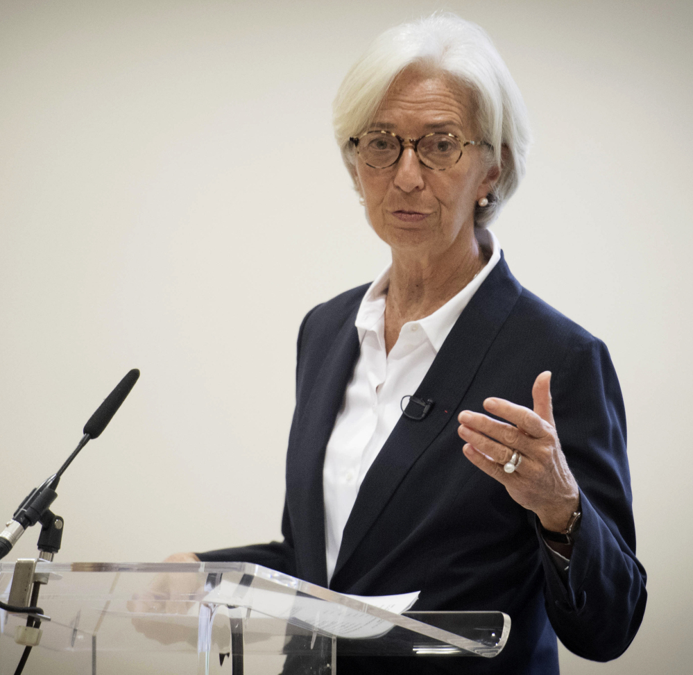 International Monetary Fund Managing Director Christine Lagarde speaks to the media Wednesday after the IMF lowered its 2017 growth forecast for the British economy.