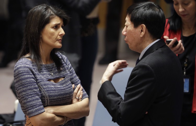 U.S. Ambassador to the United Nations Nikki Haley speaks with Chinese deputy ambassador Wu Haitao on Friday as delegates prepare to vote on sanctions against North Korea.