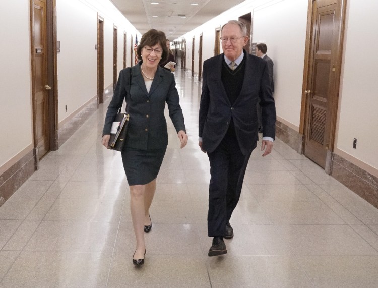 Sen. Susan Collins with Sen. Lamar Alexander, R-Tenn., at the Dirksen Office Building on Capitol Hill on Dec. 12. Both have advocated for bills that would help stabilize health insurance markets under the Affordable Care Act. Collins had hoped her colleagues would vote on the measures by year's end. That didn't happen, but she expects them to be taken up next month. 