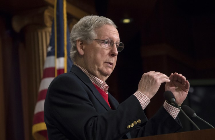 Senate Majority Leader Mitch McConnell, R-Ky., touts Republican accomplishments in the first year of the Trump administration in Washington on Friday. In addition to the tax bill passed last week, he cites the confirmation of Supreme Court Justice Neil Gorsuch and language in the tax bill to allow energy drilling in an Alaskan refuge and to terminate the Affordable Care Act's tax penalty on those who don't buy health insurance.