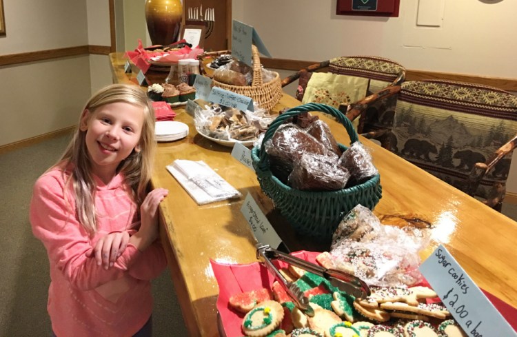 Lucy Kenney gave $100 from her bake sale to the Toy Fund after realizing some people can't afford toys. "It took a week for me and my mom to make all the treats," she says.
