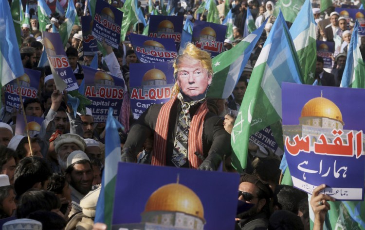 Supporters of Jamaat-e-Islami take part in an anti-American rally to condemn President Trump for declaring Jerusalem as Israel's capital, in Peshawar, Pakistan, on Friday.