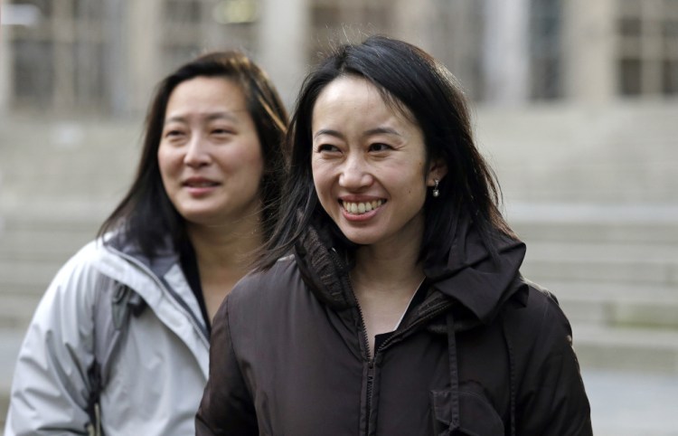 Mariko Hirose, right, a lawyer on the Jewish Family Service case and litigation director for the International Refugee Assistance Project, and Esther Sung, a staff attorney at the National Immigration Law Center,  leave the federal courthouse in Seattle after speaking with media members.