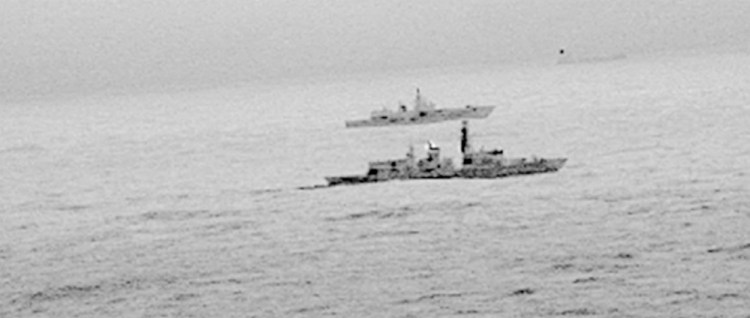 Royal Navy frigate HMS St Albans escorts a Russian warship through what Britain calls "areas of national interest" amid increasing tensions between the two countries.