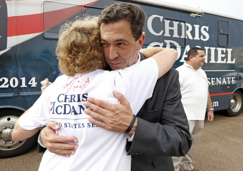 Mississippi state Sen. Chris McDaniel hugs a supporter during a 2014 U.S. Senate bid. As the Republican plans a new run, he may battle the party favorites and President Trump.