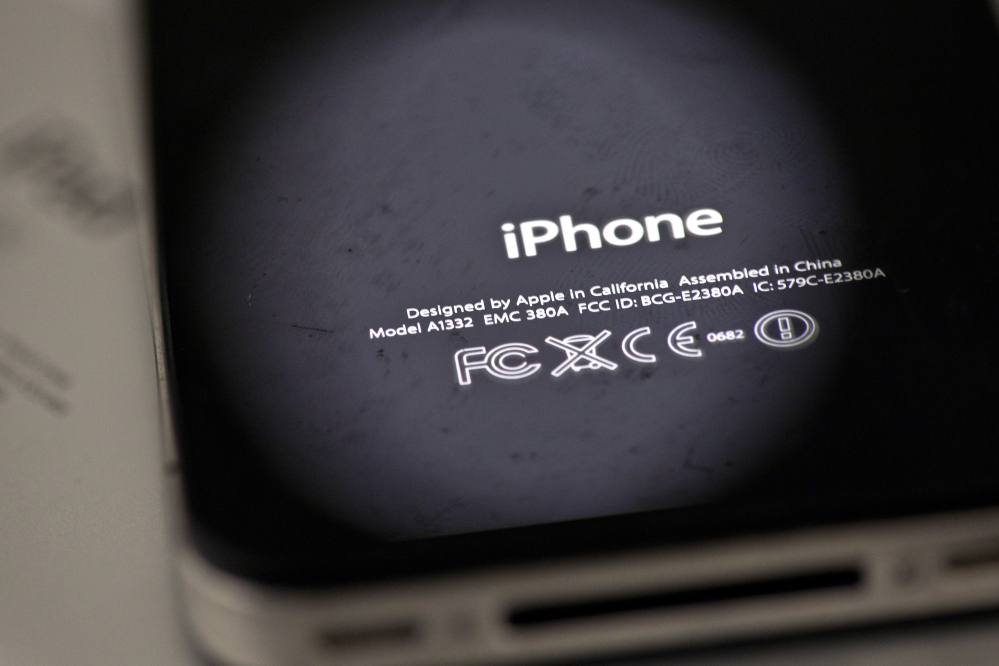 Apple is apologizing for secretly slowing down older iPhones, like the one pictured in this file photograph.