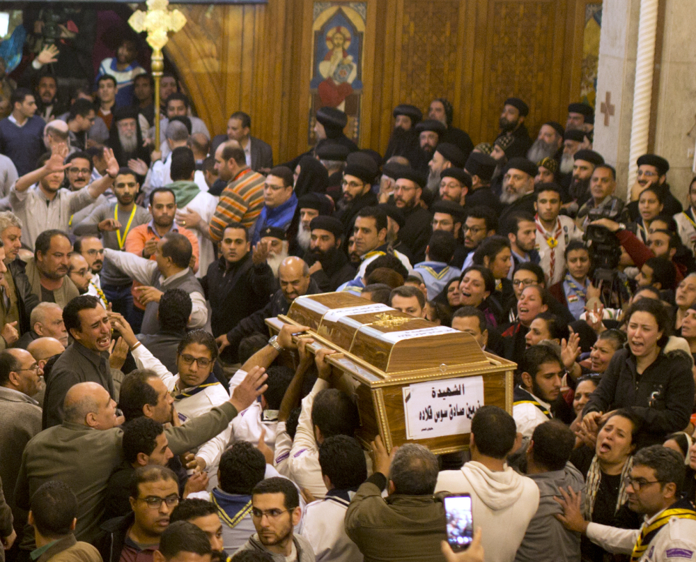 During a funeral service in Cairo, Egypt, Coptic Christians grieve as they carry the coffin of a victim of the attack on Mar Mina church. It was the latest attack aimed at Egypt's Christian minority.