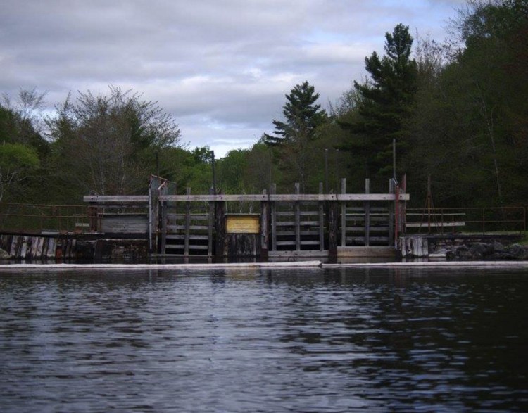 This dam on East Grand Lake straddles the Maine-New Brunswick border at Forest City. Woodland Pulp, which owns it, wants to avoid federal licensing requirements by having the state take ownership of the U.S. side of the structure.