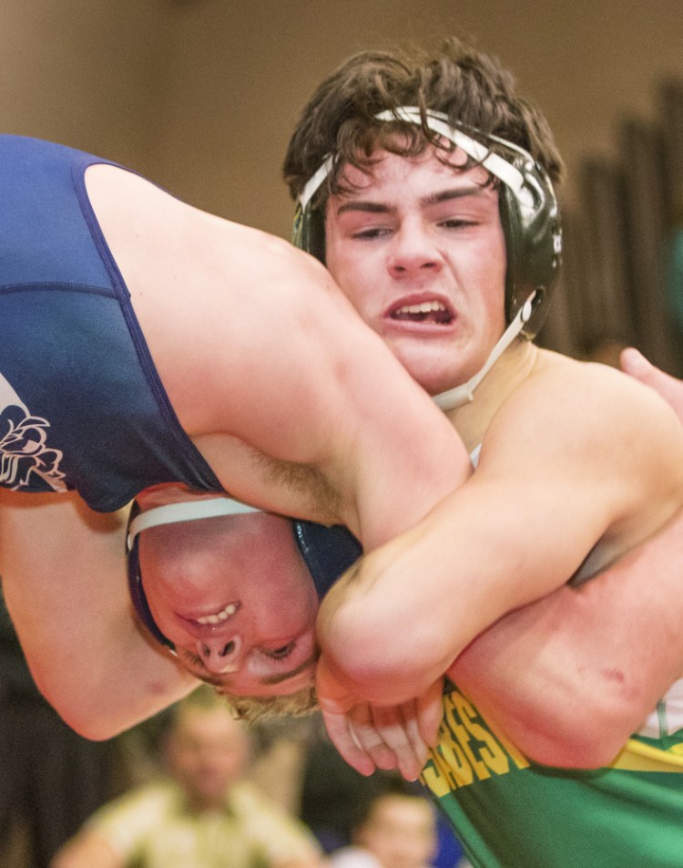 Matt Pooler of Massabesic, right, competes with Zack Elowitch of Portland in the 152-pound semifinals Saturday during the Noble Invitational. Elowitch advanced to the final with a win, then finished second in the class.