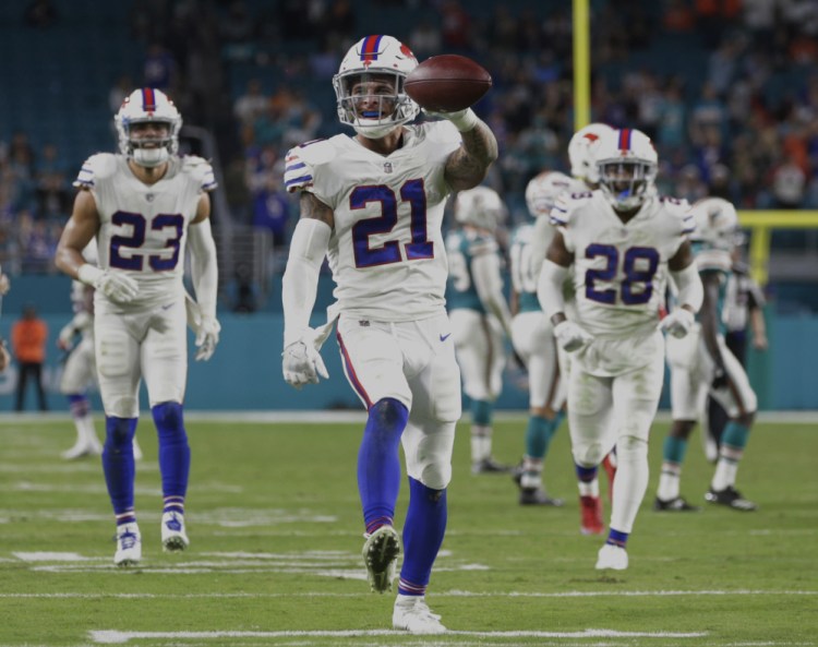 Bills safety Jordan Poyer celebrates after his interception with less than a minute remaining clinched Buffalo's 22-16 win Sunday against the Dolphins, sending the Bills to the playoffs.