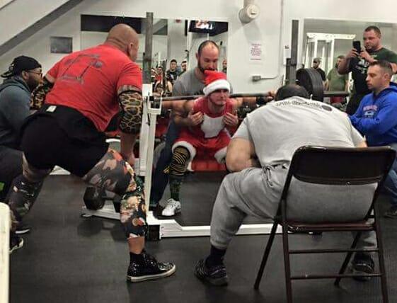 A lifter dressed as Santa Claus executes a squat lift at last year's Squat for Tots, a powerlifting competition benefiting the Toys for Tots Foundation at Black Bridge Crossfit in Brunswick.