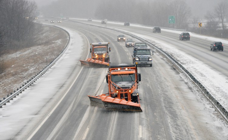 To combat a chronic shortage of full-time transportation workers in southern Maine, the state is paying private contractors to drive plow trucks and work on road crews. Roughly 24 contractors are expected to work for Maine Department of Transportation road crews in Freeport, Alfred and Yarmouth through October 2018. The department has had difficulty recruiting and keeping workers in York and Cumberland counties, where a strong economy is siphoning current and potential employees into better-paying municipal and private-sector jobs. The department has about 50 openings. First Vehicle Services, based in Cincinnati, was awarded a contract in September to provide 10 year-round hourly workers in both Freeport and Alfred, with a provision to expand to 40 more workers. The department has already asked for four more workers based in Yarmouth. Above, snowplows make their way up the Maine Turnpike in Saco at the start of a snowfall.