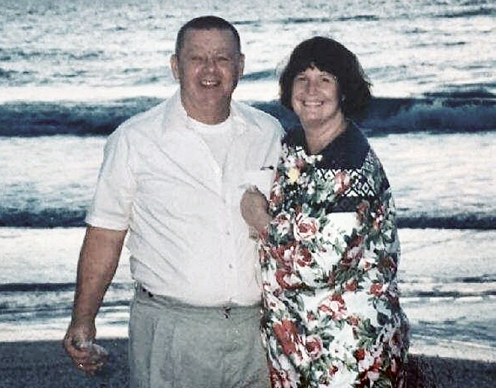 Clyde and Kim Shue are seen in an undated family photo. Police say that the married couple died in an apparent murder-suicide in their Manchester home on Saturday, with Clyde apparently shooting his wife and then himself. 