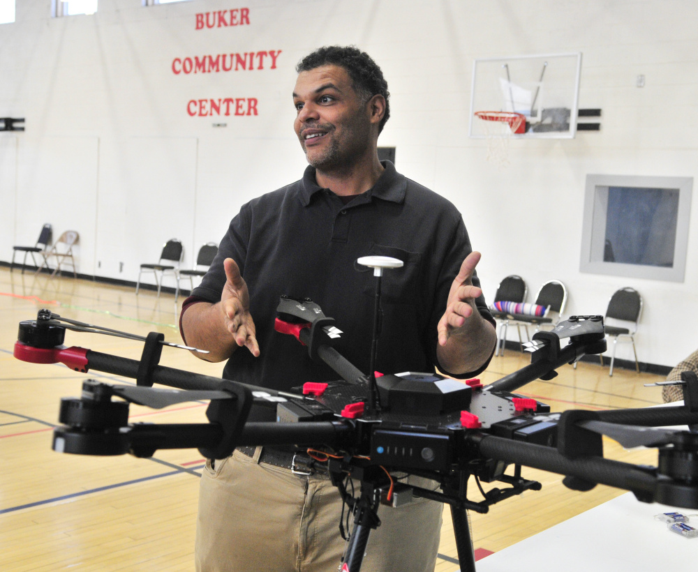 Kristopher Kleva talks about a large industrial drone during a demonstration for Augusta Boys and Girls Club on Friday at The Buker Center in Augusta.