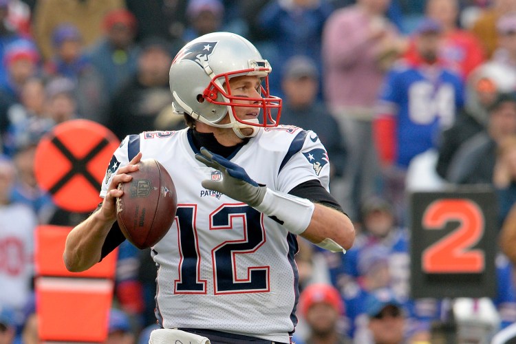 Pats QB Tom Brady looks for an open receiver during the first half against the Bills on Dec. 4.  Brady was 21 of 30 for 258 yards and broke Brett Favre's NFL record for most wins by a quarterback against one opponent, with 27. 