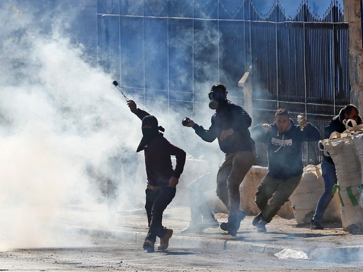 Palestinians clash with Israeli troops in the West Bank city of Bethlehem Friday.