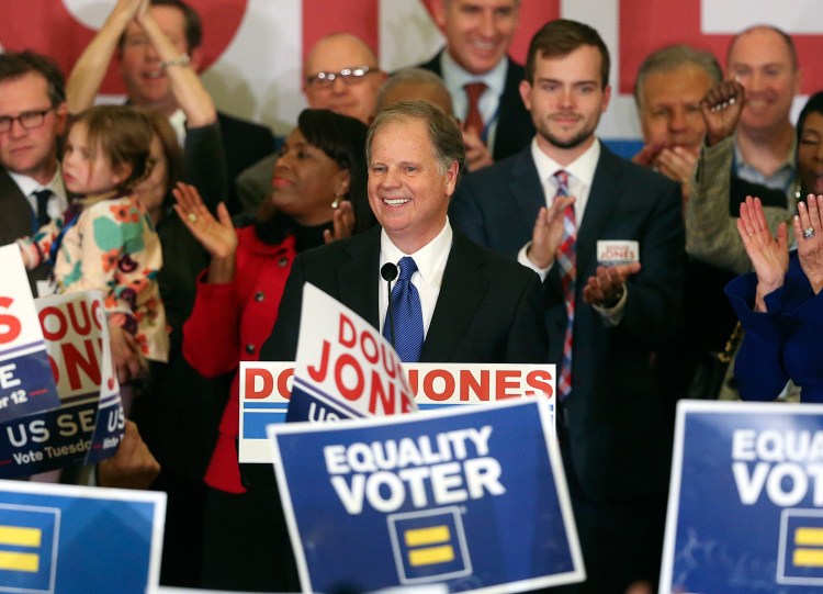 Democrat Doug Jones speaks to supporters Tuesday night in Birmingham, Ala., during a celebration of his victory in Alabama's special Senate election.