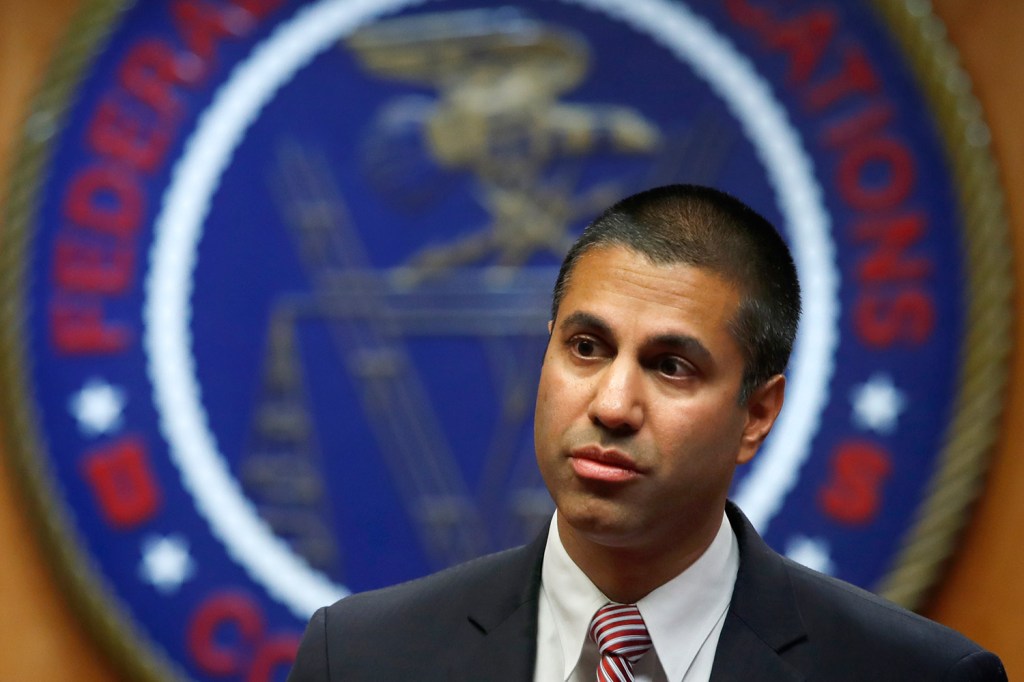 Federal Communications Commission Chairman Ajit Pai arrives for Thursday's meeting on net neutrality. He said, "Quite simply, we are restoring the light-touch framework that has governed the internet for most of its existence."