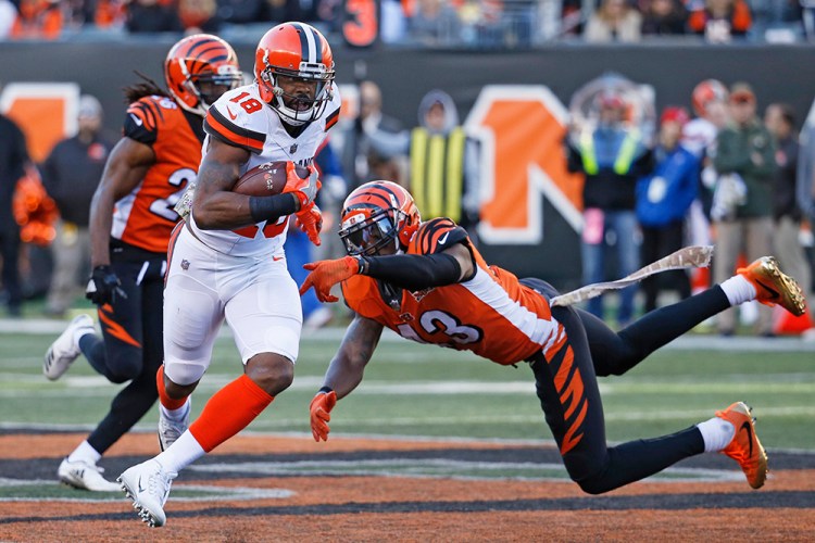 Browns receiver Kenny Britt shakes off Cincinnati Bengals free safety George Iloka on Nov. 26.