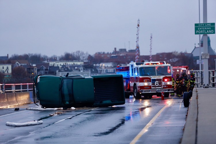 A truck overturned on the Casco Bay Bridge between Portland and South Portland on Tuesday afternoon, blocking both lanes of traffic headed into South Portland. 