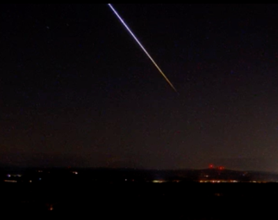 A meteor streaks across the sky Tuesday, as seen from the Mount Agamenticus webcam in York County.