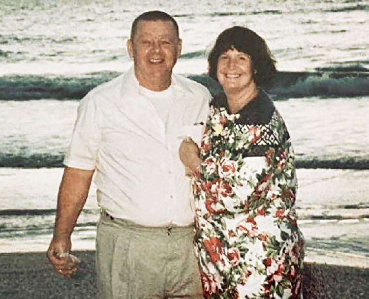 Clyde and Kim Shue are seen in an undated family photo. Police say that the married couple died in an apparent murder-suicide in their Manchester home on Saturday, with Clyde apparently shooting his wife and then himself. 