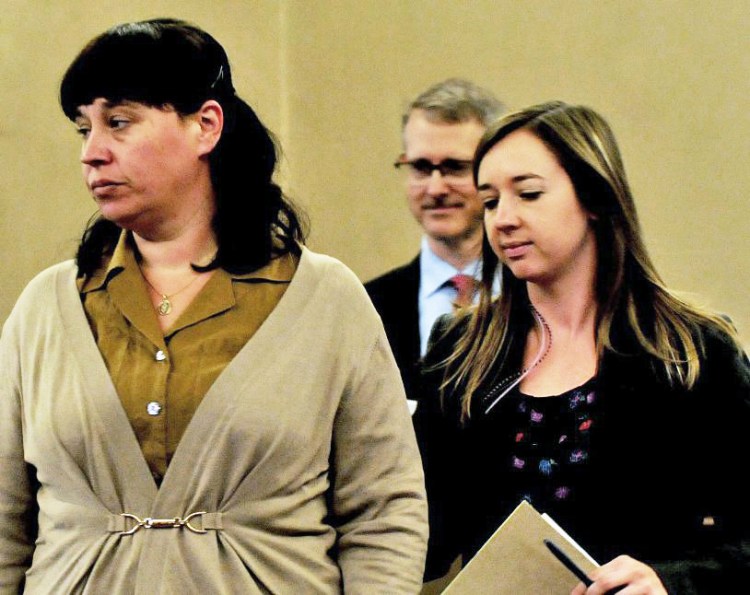 Miranda Hopkins, left, and her attorneys, Laura Shaw and Christopher MacLean appear in Waldo County Superior Court in Belfast for the start of her manslaughter trial on Oct 31.