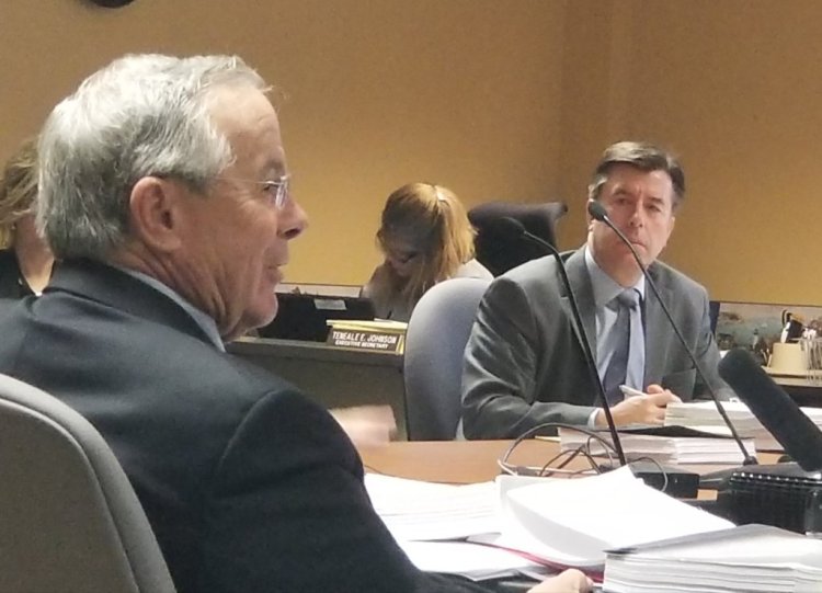 Dr. John Kelly, left, an oral surgeon who worked at Massachusetts General Hospital and Yale-New Haven Hospital, told the Maine Board of Dental Practice on Friday that Dr. Jan Kippax did not mistreat patients who filed complaints against him. Looking on is Dr. Glen Davis, one of the five board members.