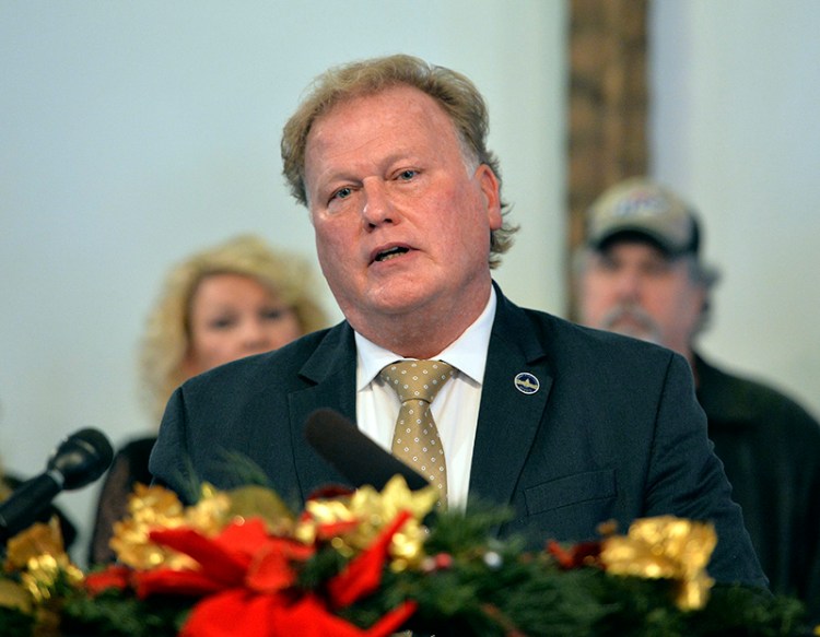 With friends and family standing behind him, Kentucky State Rep., Republican Dan Johnson addressed the public from his church on Dec. 12, 2017.