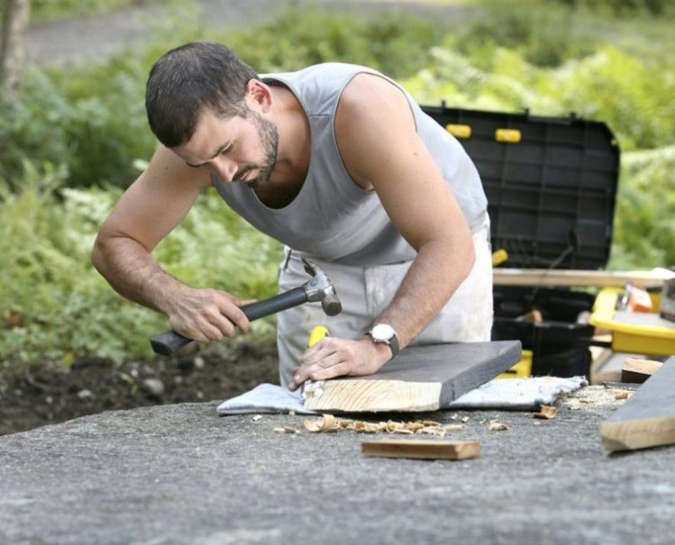 Wade Kavanaugh works on one of his picnic-table creations at Peaks-Kenny State Park in 2010.