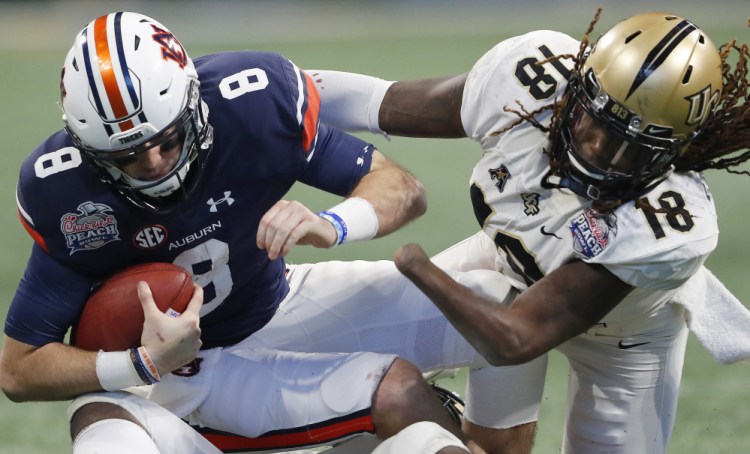 Central Florida linebacker Shaquem Griffin sacks Auburn quarterback Jarrett Stidham and the Knights capped their perfect season with a 34-27 win in the Peach Bowl on Monday in Atlanta.