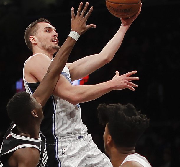 Orlando guard Mario Hezonja takes a shot while being guarded by Brooklyn's Caris LeVert during the Nets' 98-95 victory in New York.