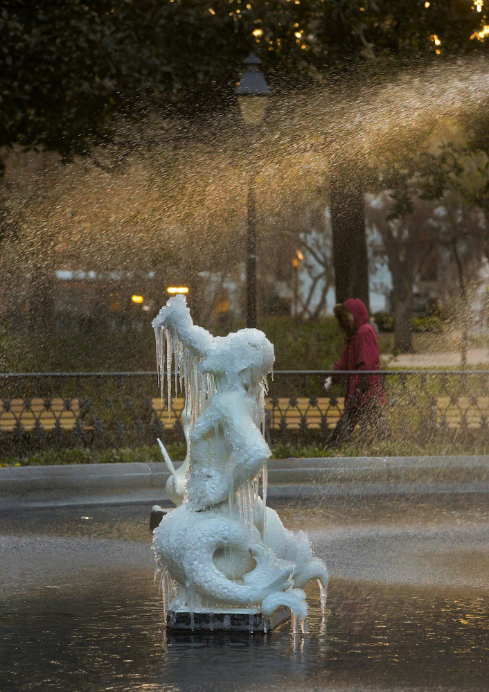 Icicles form on the tritons in the Forsyth Park Fountain on Tuesday morning in Savannah, Ga.  Savannah is shivering through a rare bout with icy weather, with the National Weather Service predicting that up to 2 inches of snow and sleet could fall Wednesday on the typically balmy coastal city. Triton was a fish-tailed Greek sea god.
