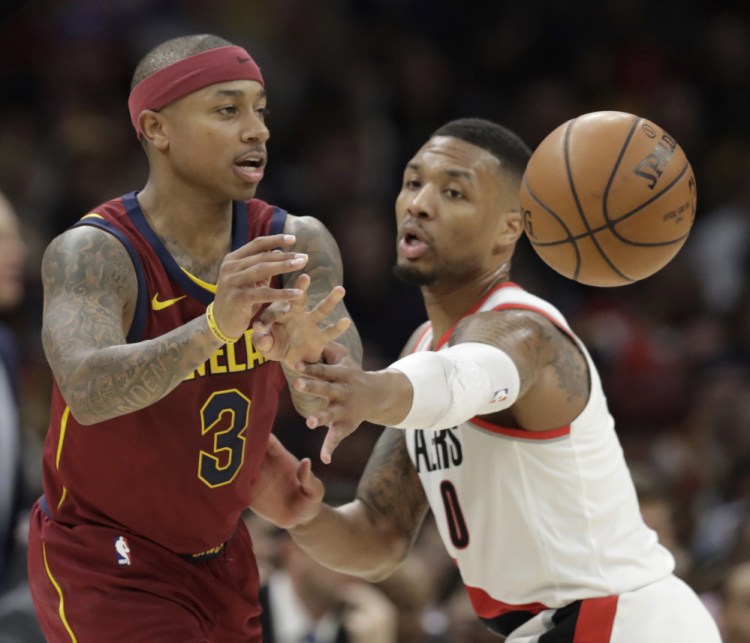 Isaiah Thomas, passing against Damian Lillard of Portland, scored 17 points in 19 minutes Tuesday night for Cleveland in his return.